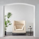 Allermuir Host table next to a cream armchair in a white arched nook
