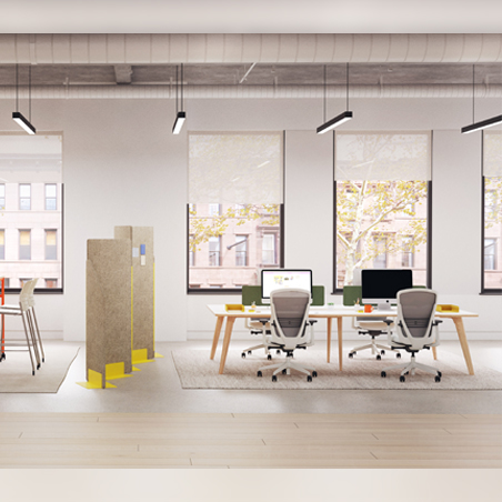 A pair of grey Senator Ousby mesh chairs at a shared workstation in a bright and modern open-plan office