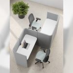 High-angle view of the grey Nastro 2-person work pod in an office setting, configured with two workstations and office chairs