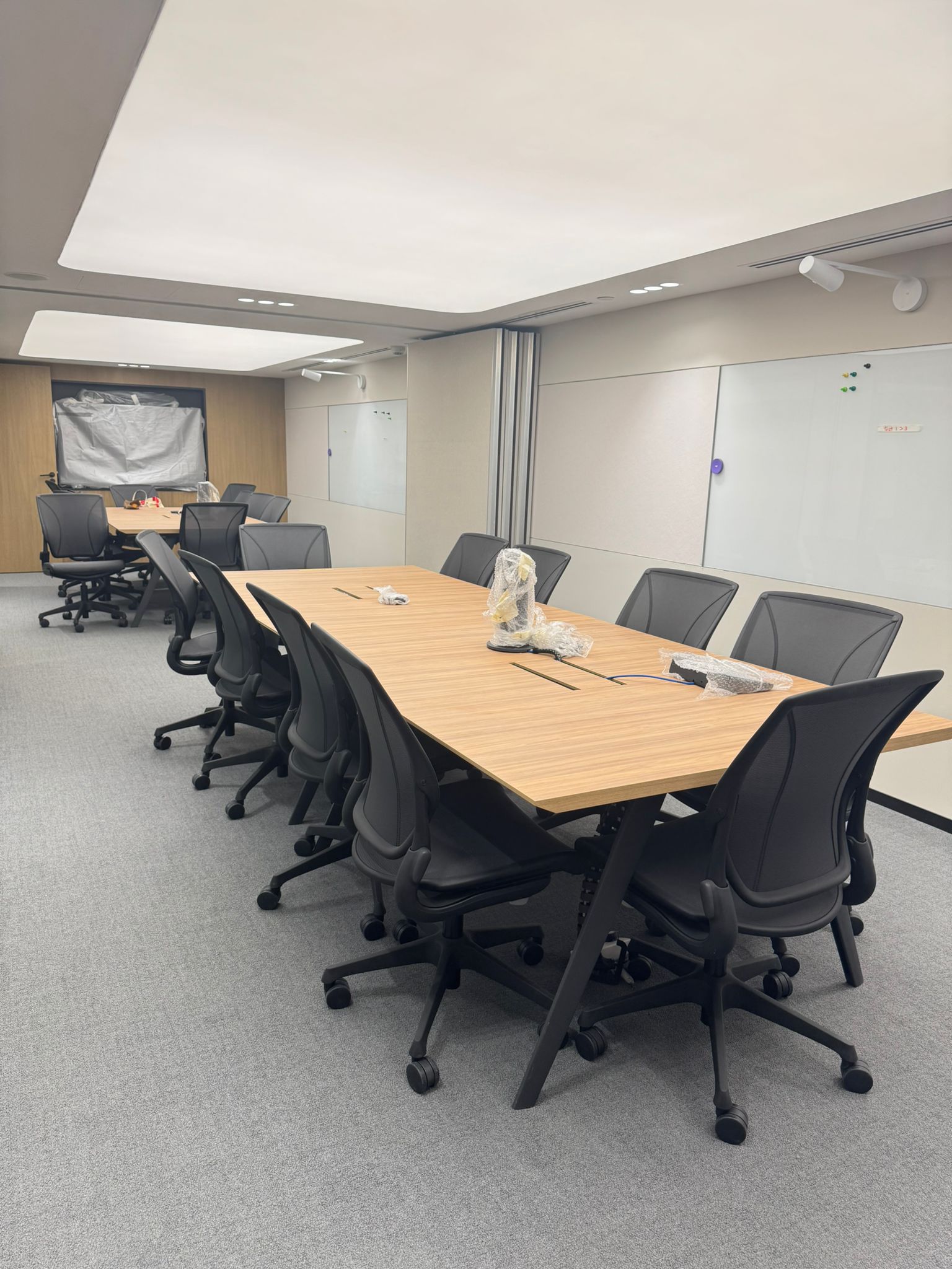 tapestry conference room wuth long meeting table